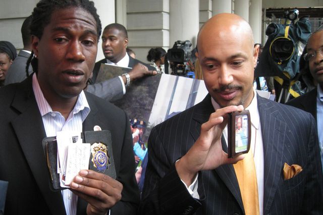 Jumaane Williams and Kirsten John Foy showing the offical IDs they showed cops before their arrest.